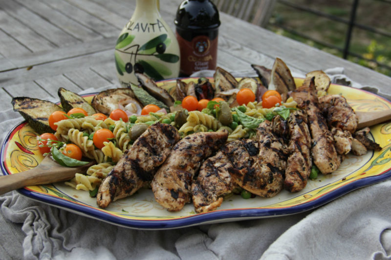 pasta with pesto and grilled chicken and vegetables
